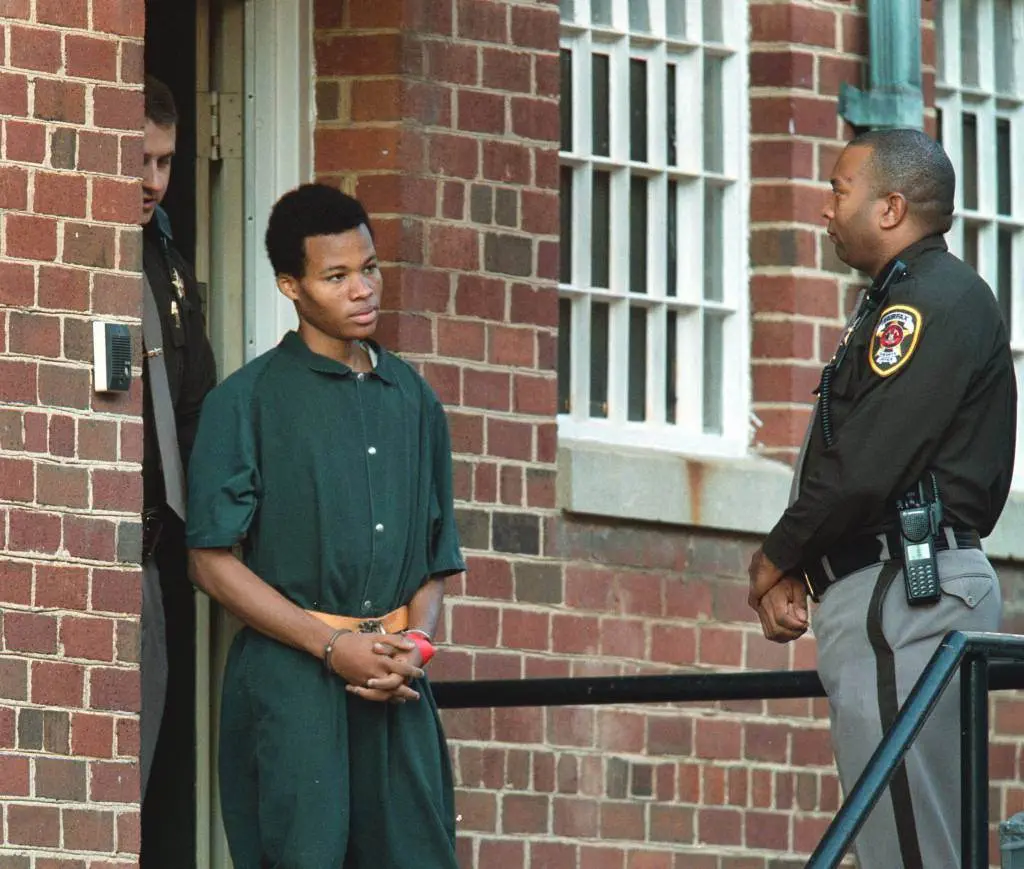 Convicted DC sniper Lee Boyd Malvo being escorted out of prison